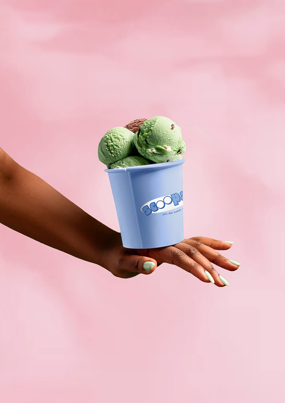 Hand with ice cream tub